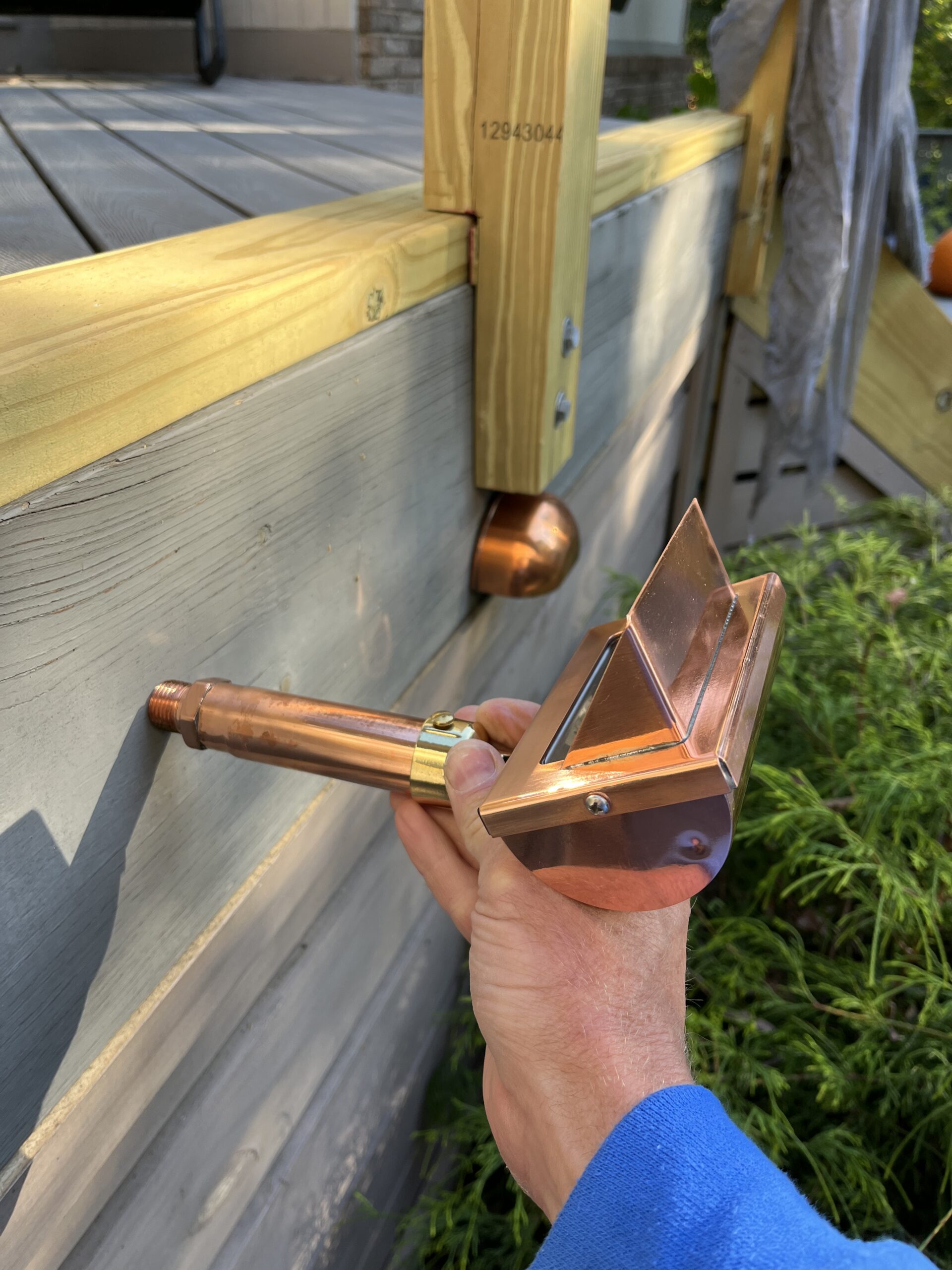 Professional outdoor lighting repair and LED upgrades being performed on a residential system in Greenville SC